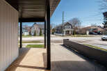 Discover the charm of this beautifully designed property, featuring a welcoming porch and a modern aesthetic.