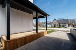 This stunning property boasts a modern design with a welcoming porch, perfect for enjoying the outdoors.