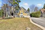 This stunning property boasts a beautiful exterior with a combination of stone and yellow siding, creating a warm and inviting curb appeal.