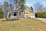This stunning property boasts a beautiful exterior with a combination of stone and siding, creating a timeless appeal.