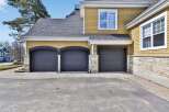This stunning property boasts a beautiful exterior with a multi-car garage, perfect for families or car enthusiasts.