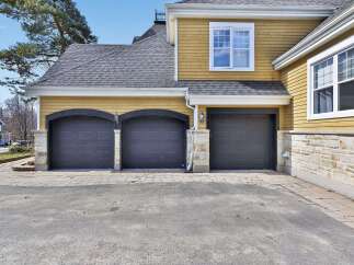 This stunning property boasts a beautiful exterior with a multi-car garage, perfect for families or car enthusiasts.