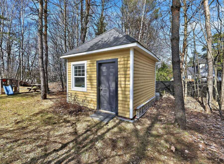 This charming property features a well-maintained shed, perfect for storage or a workshop.