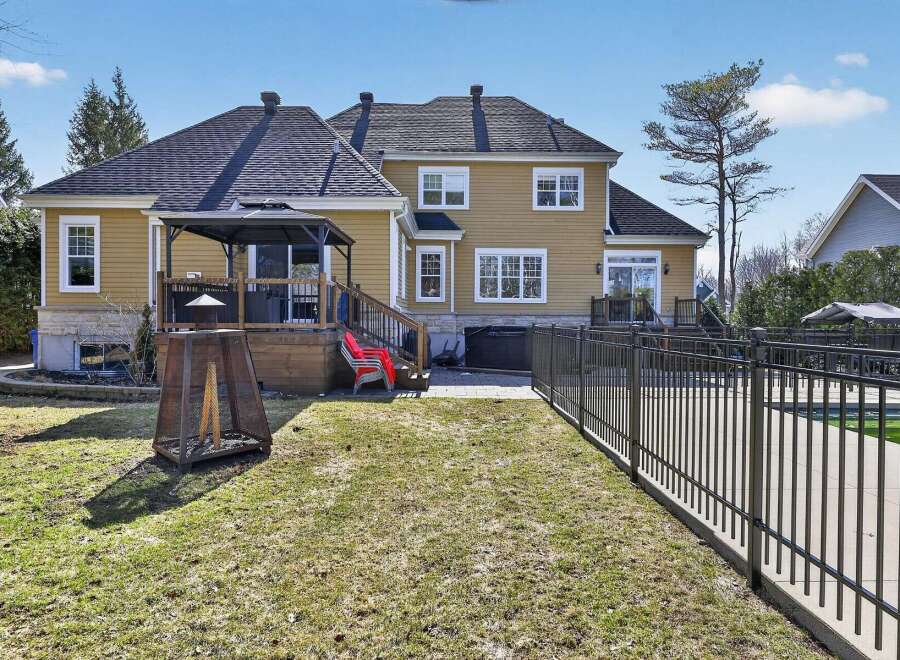 Enjoy outdoor living at its finest with this stunning property featuring a spacious backyard.