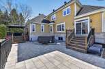 Enjoy outdoor living at its finest with this stunning property featuring a spacious patio and a luxurious hot tub.