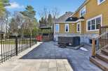 Enjoy outdoor living at its finest with this stunning property featuring a spacious patio and a luxurious hot tub.