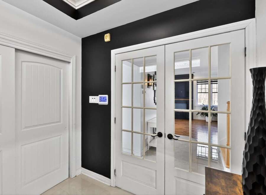 Step into elegance with this stunning property, featuring a bright and airy entryway.