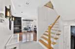 Step into luxury with this stunning property featuring a grand staircase and modern design.