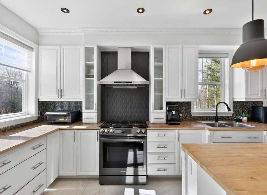 Step into this stunning kitchen, a true highlight of the property! Featuring modern appliances, ample counter space, and stylish cabinetry, it's perfect for culinary enthusiasts.