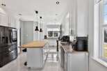 Step into this stunning kitchen, boasting a sleek, modern design with ample storage and counter space.