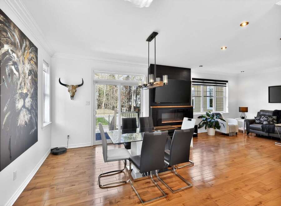 This stunning property boasts a modern dining area, perfect for entertaining guests.