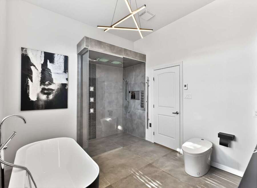 Step into luxury with this stunning bathroom featuring a modern design and high-end finishes.