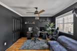 Step into this stylish home office, featuring a sleek black aesthetic and modern design.