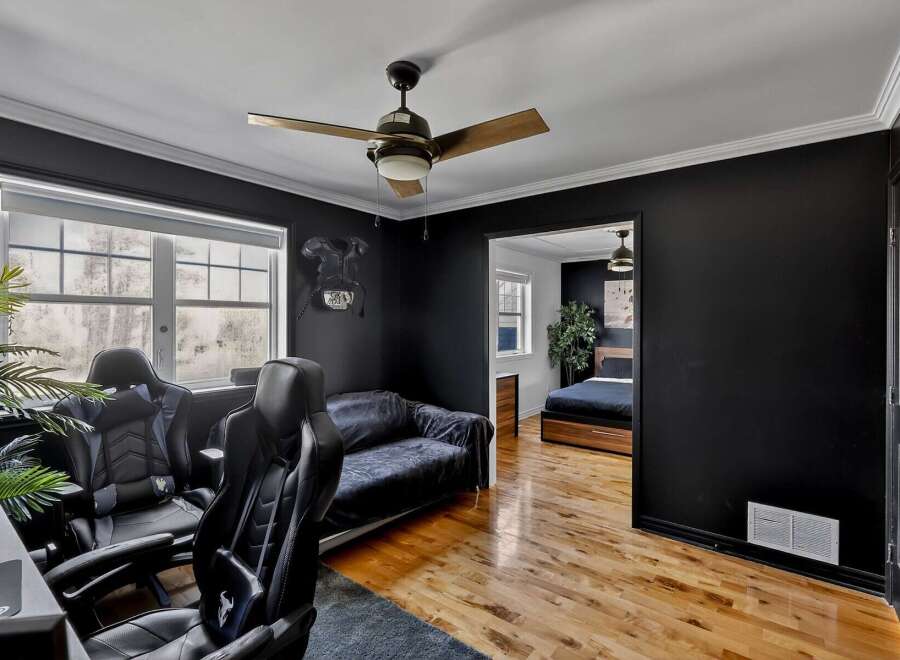 Step into modern luxury with this stunning property! Featuring a sleek, black-walled interior, this home offers a stylish and contemporary living space.