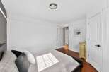 Discover the charm of this inviting bedroom, featuring a comfortable bed and ample natural light.