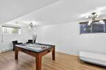 This stunning property boasts a spacious game room, perfect for entertaining guests or enjoying a relaxing evening.
