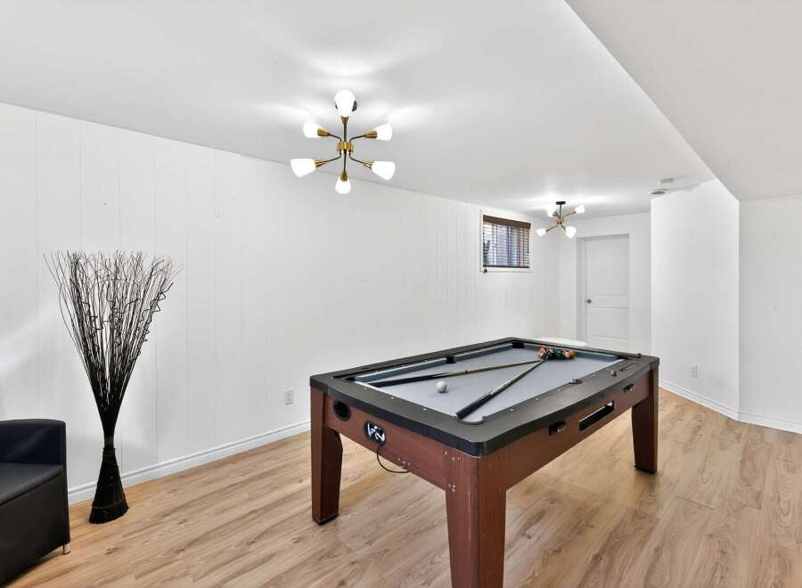 This stunning property boasts a spacious game room, perfect for entertaining guests or enjoying quality time with family.