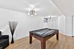 This stunning property boasts a spacious game room, perfect for entertaining guests or enjoying quality time with family.