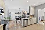 This stunning kitchen boasts modern design with stainless steel appliances and ample counter space.