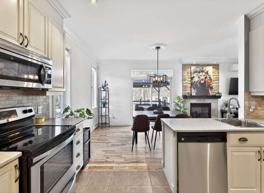 Step into this stunning kitchen, featuring stainless steel appliances and ample counter space, perfect for culinary enthusiasts.