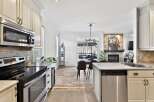 Step into this stunning kitchen, featuring stainless steel appliances and ample counter space, perfect for culinary enthusiasts.