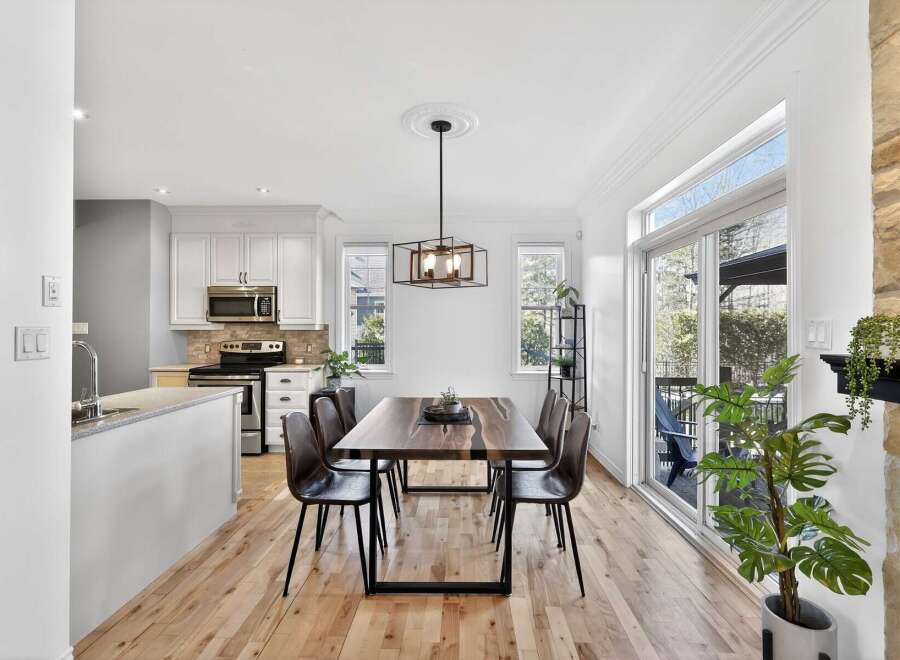This stunning property boasts a modern dining area, perfect for hosting gatherings.