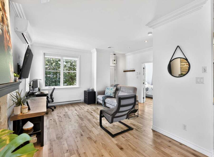 Discover modern living in this stylish property, featuring a bright and airy interior with hardwood floors throughout.