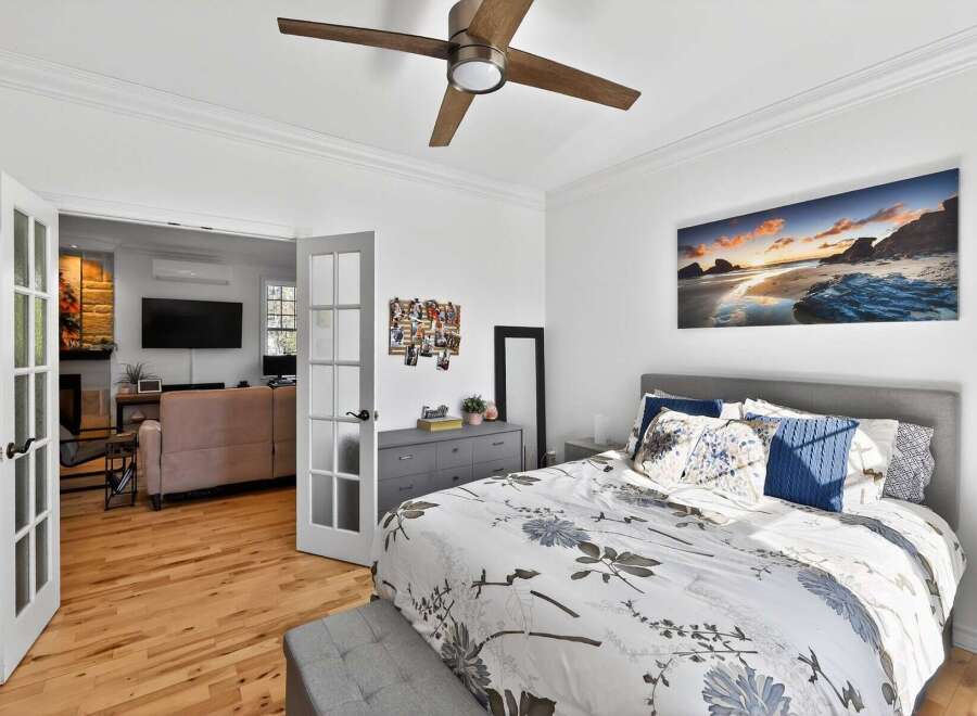 Step into this beautifully designed bedroom, featuring a serene ambiance and modern touches.