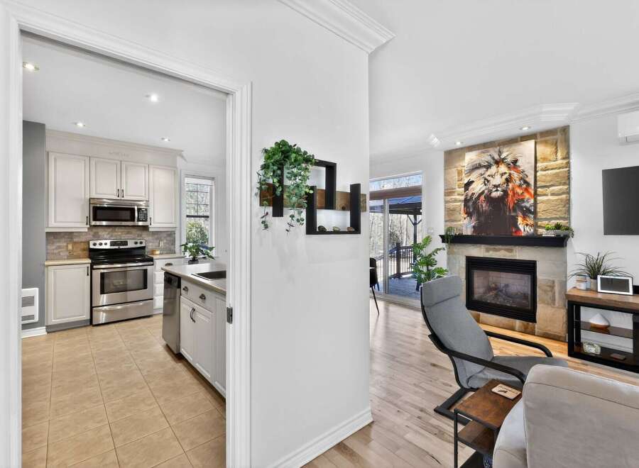 Step into luxury with this stunning property, featuring a modern kitchen and a cozy living area.