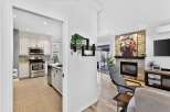 Step into luxury with this stunning property, featuring a modern kitchen and a cozy living area.