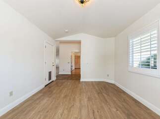Step into this inviting space with beautiful wood flooring and ample natural light.