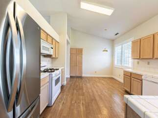 This stunning kitchen boasts a modern design with ample natural light.
