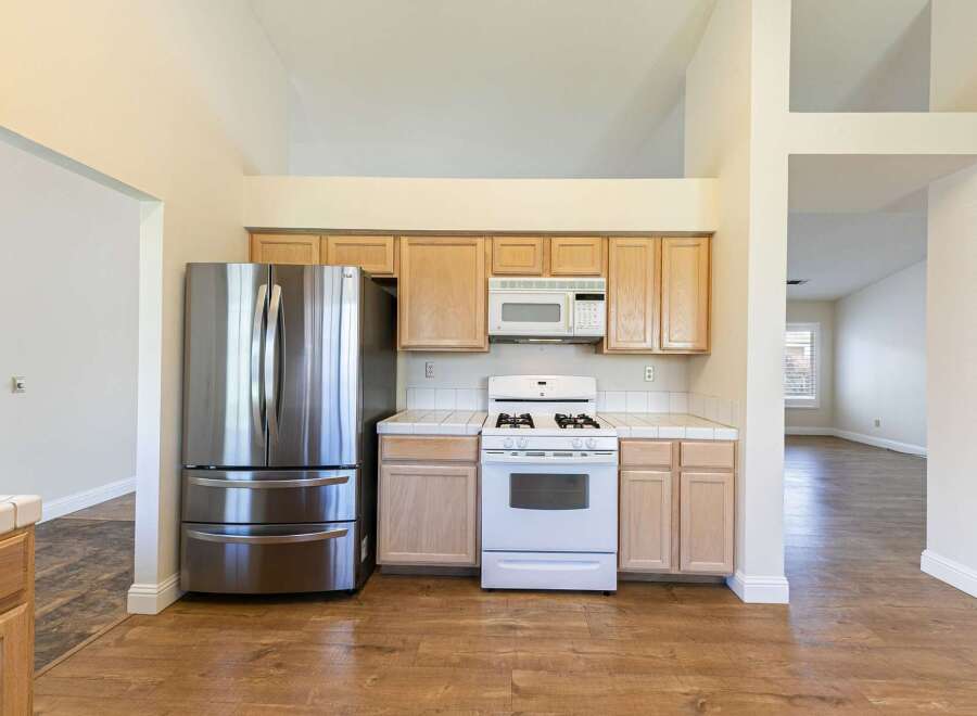 This stunning kitchen boasts modern appliances and ample counter space, perfect for culinary enthusiasts.