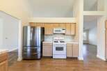 This stunning kitchen boasts modern appliances and ample counter space, perfect for culinary enthusiasts.