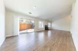 Step into this inviting living space, featuring a seamless blend of natural light and modern design.