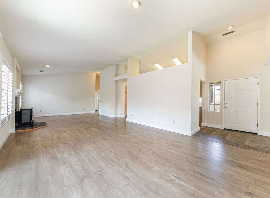 Step into this bright and airy living space, featuring a modern design and ample natural light.