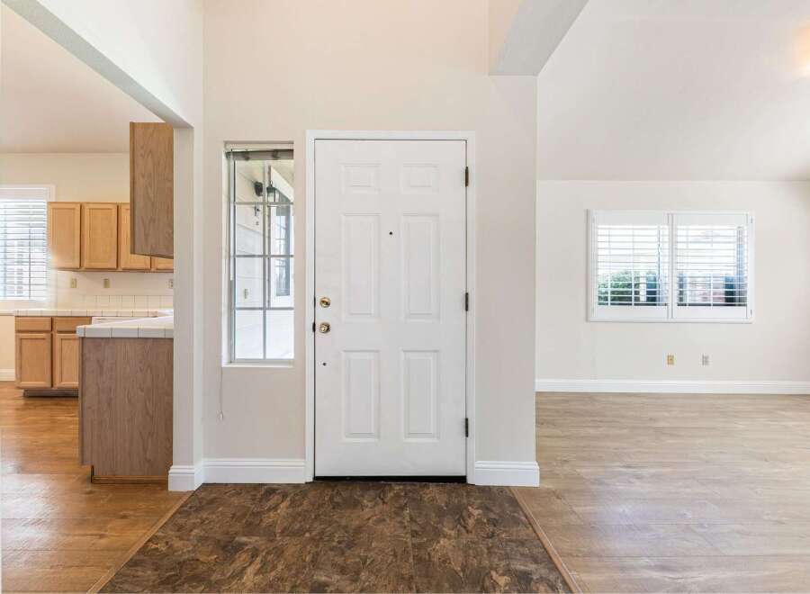 Step into this inviting home and be greeted by a bright and airy entryway.
