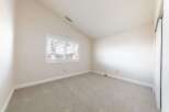 This inviting room features a neutral color palette, creating a versatile space ready for personalization.