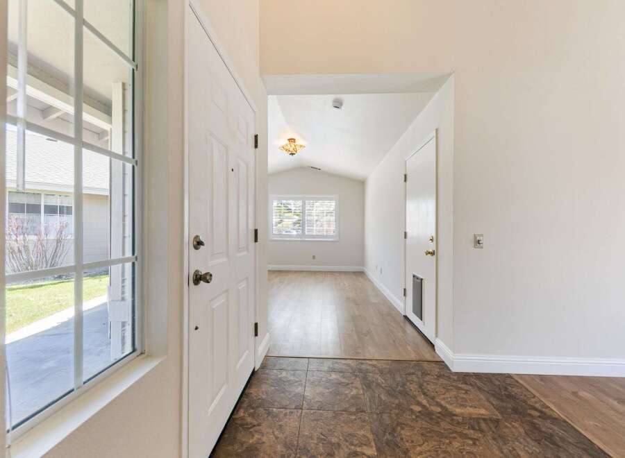 Step into this inviting entryway, showcasing a bright and airy atmosphere.