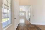 Step into this inviting entryway, showcasing a bright and airy atmosphere.