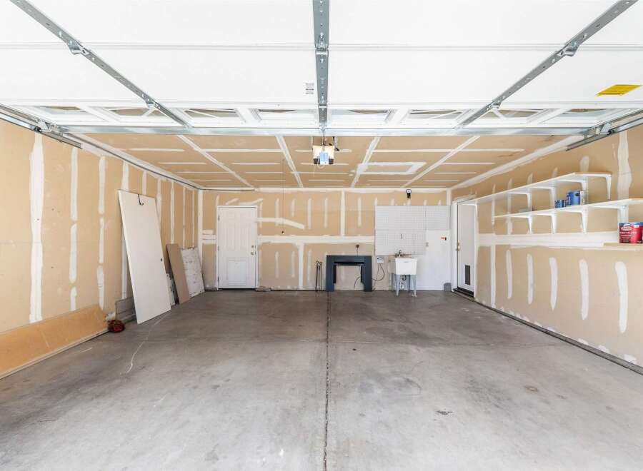 This spacious garage offers ample room for parking and storage.