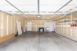 This spacious garage offers ample room for parking and storage.