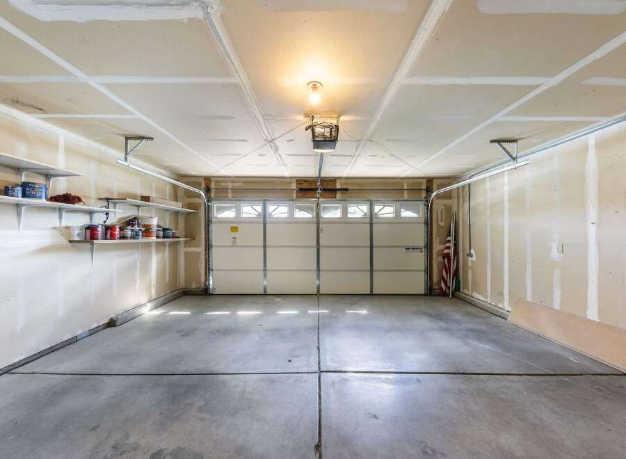 Step into this spacious garage, perfect for storing vehicles or creating a workshop.