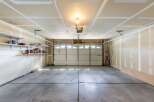 Step into this spacious garage, perfect for storing vehicles or creating a workshop.