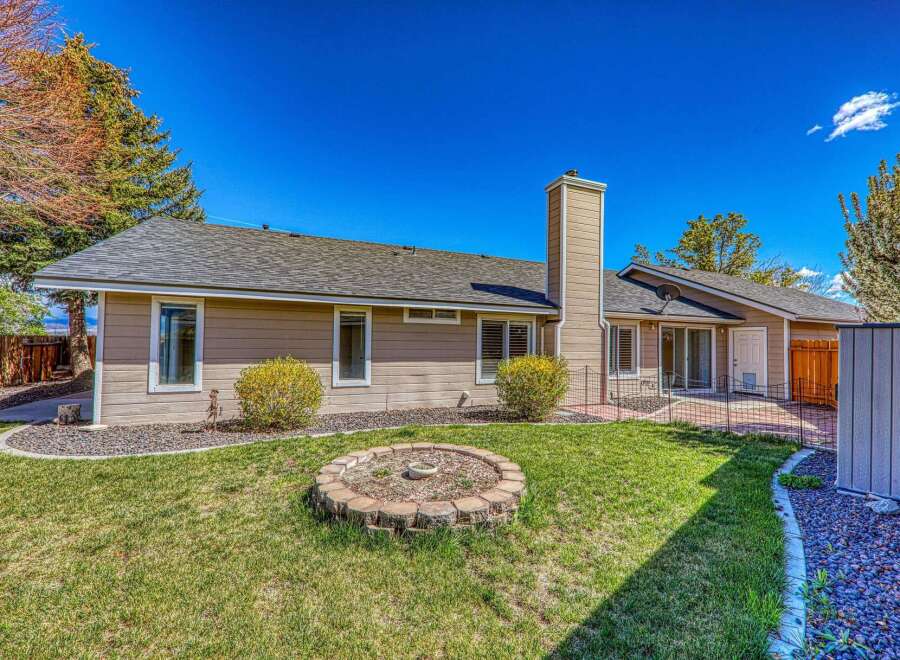 Discover the charm of this beautiful home, featuring a well-maintained exterior and a welcoming backyard.
