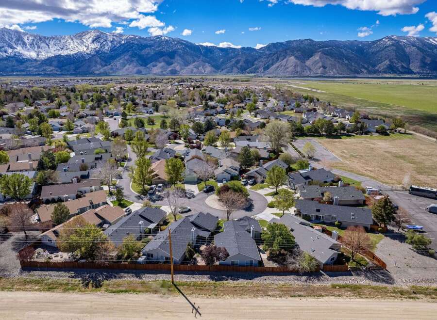 Discover the charm of this beautiful neighborhood nestled against a stunning mountain backdrop.