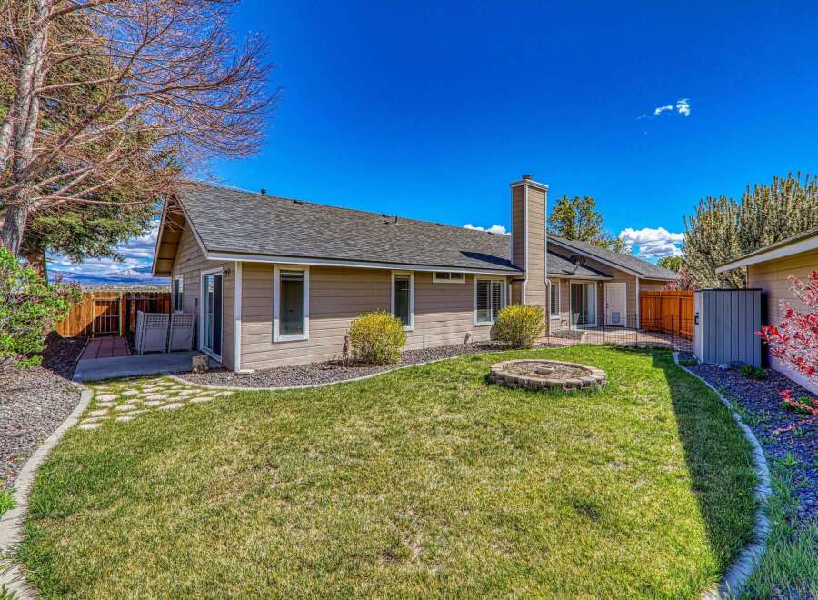 Enjoy the tranquility of this beautiful home with a spacious backyard, perfect for outdoor gatherings.