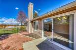 Enjoy outdoor living in this beautiful home with a spacious patio and a well-maintained yard.