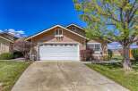 Discover this charming property featuring a spacious driveway and a well-maintained lawn.