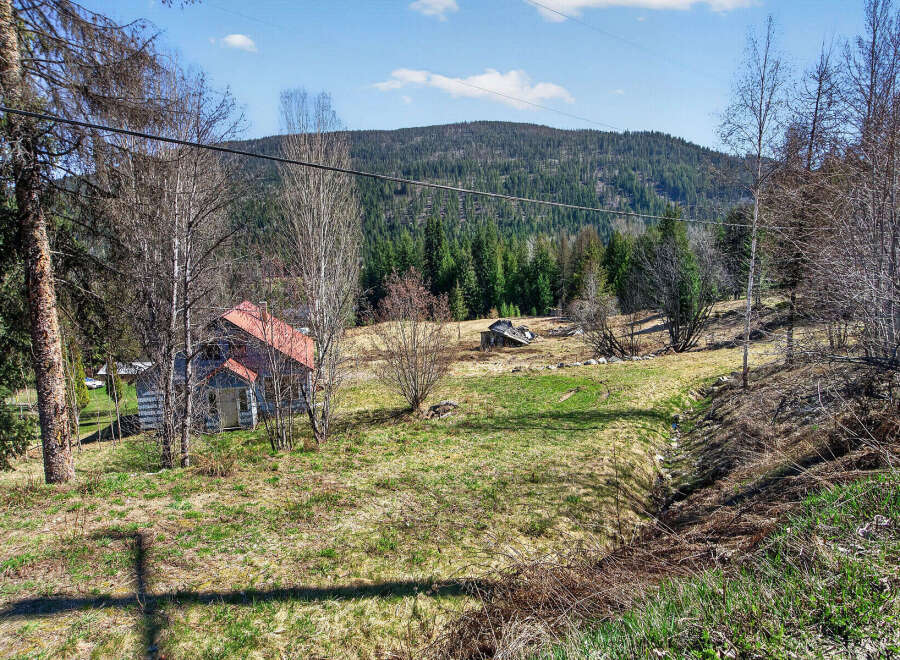Discover a charming property nestled in a serene natural setting.
